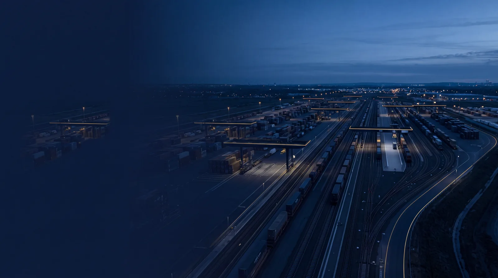Intermodal logistics hub with rail lines and gantries